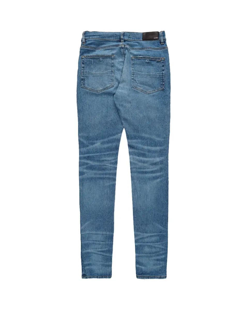 Amiri knee-ripped blue skinny jeans